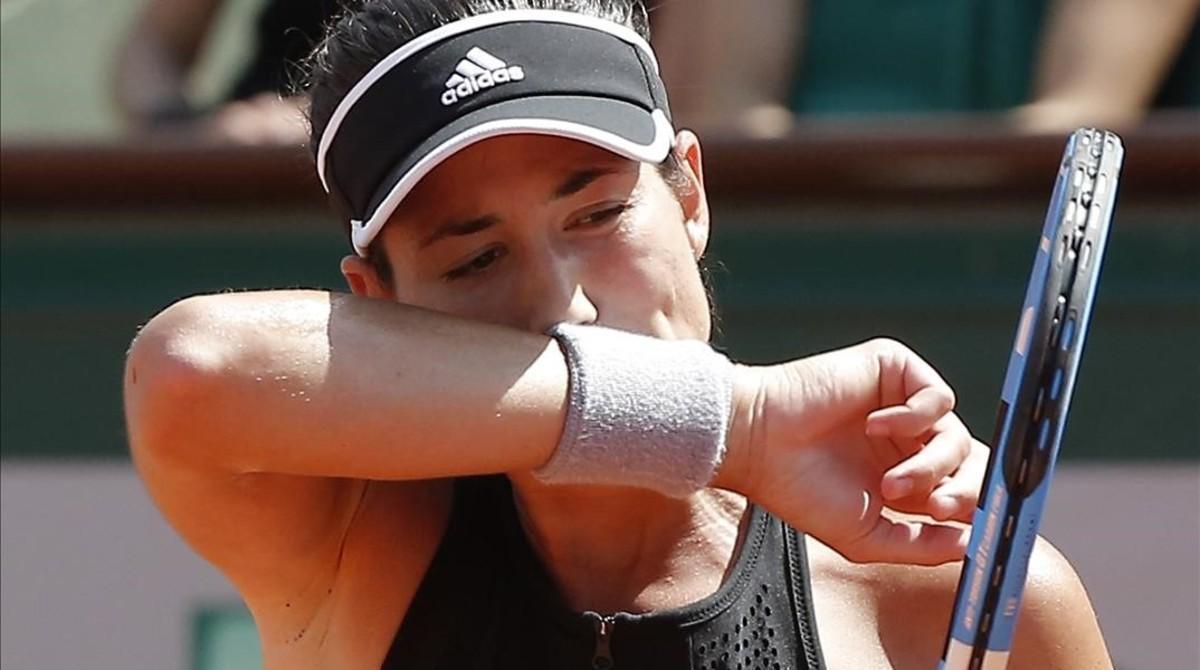 jpujol43647835 spain s garbine muguruza wipes her face as she plays romania180607155858