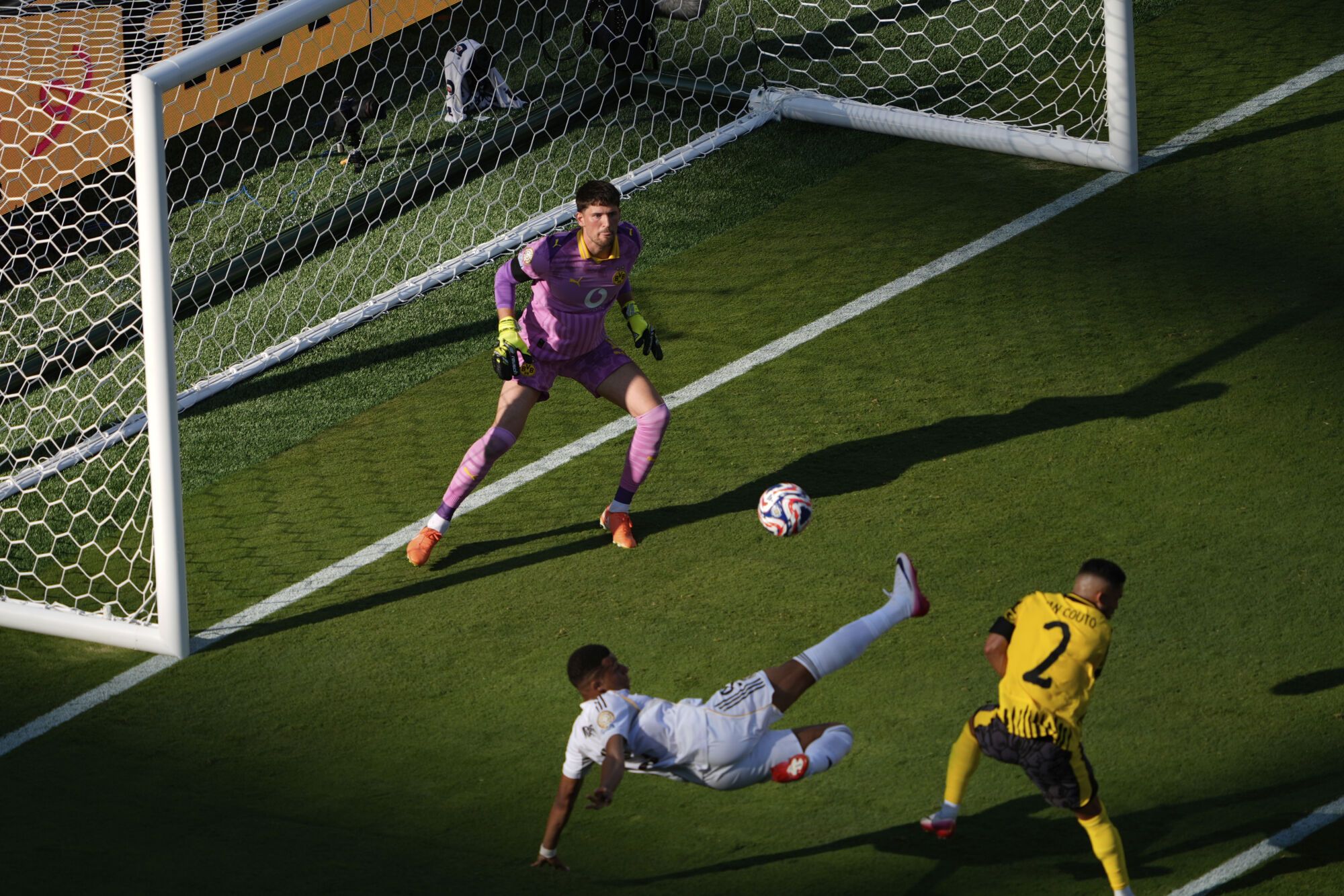 Real Madrid's Kylian Mbappe, bottom, scores his side's 3rd goal during the Club World Cup quarterfinal soccer match between Real Madrid and Borussia Dortmund in East Rutherford, N.J., Saturday, July 5, 2025. (AP Photo/Pamela Smith)