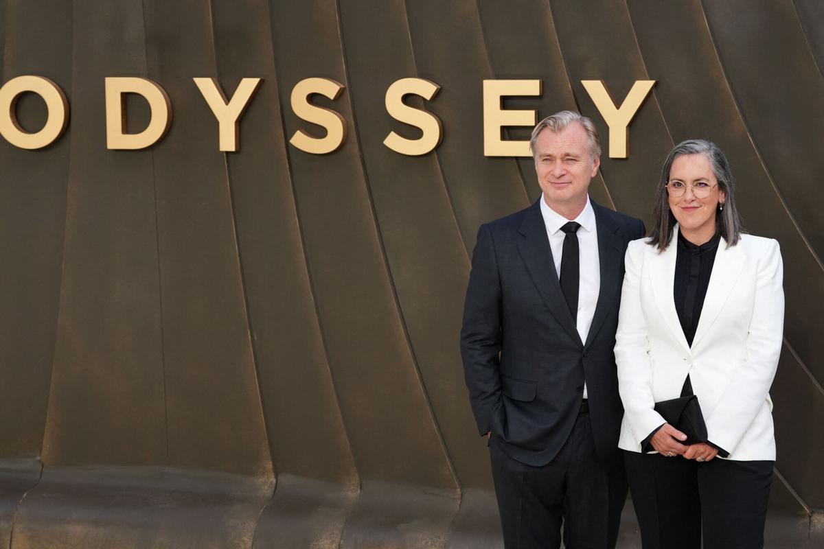 British-US film director Christopher Nolan and British film producer Emma Thomas pose on the red carpet upon arrival to attend the world premiere of the film 'The Odyssey' in London on July 6, 2026. (Photo by CARLOS JASSO / AFP)