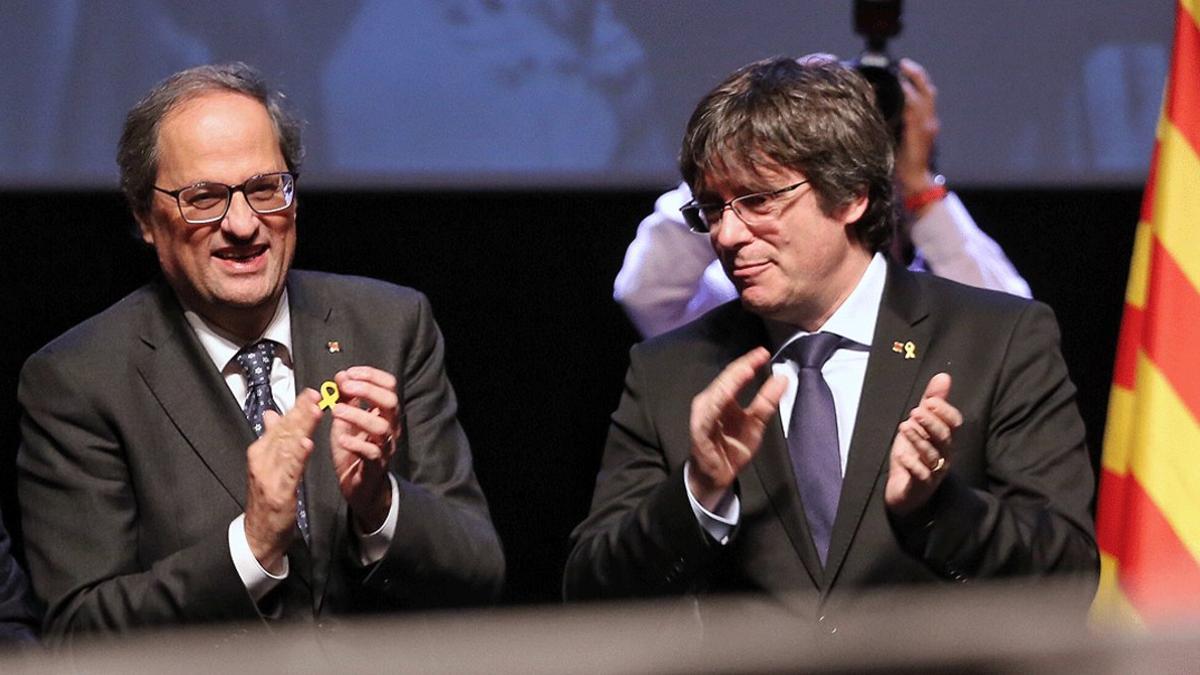 Quim Torra y Carles Puigdemont, en un acto en Bruselas en febrero del 2019