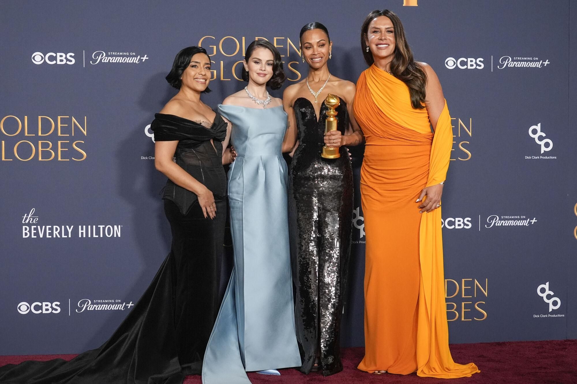 Adriana Paz, from left, Selena Gomez, Zoe Saldana, winner of the award for best performance by a female actor in a supporting role in any motion picture for "Emilia Perez," and Karla Sofia Gascon pose in the press room during the 82nd Golden Globes on Sunday, Jan. 5, 2025, at the Beverly Hilton in Beverly Hills, Calif. (AP Photo/Chris Pizzello). 010525131219, 21334631,