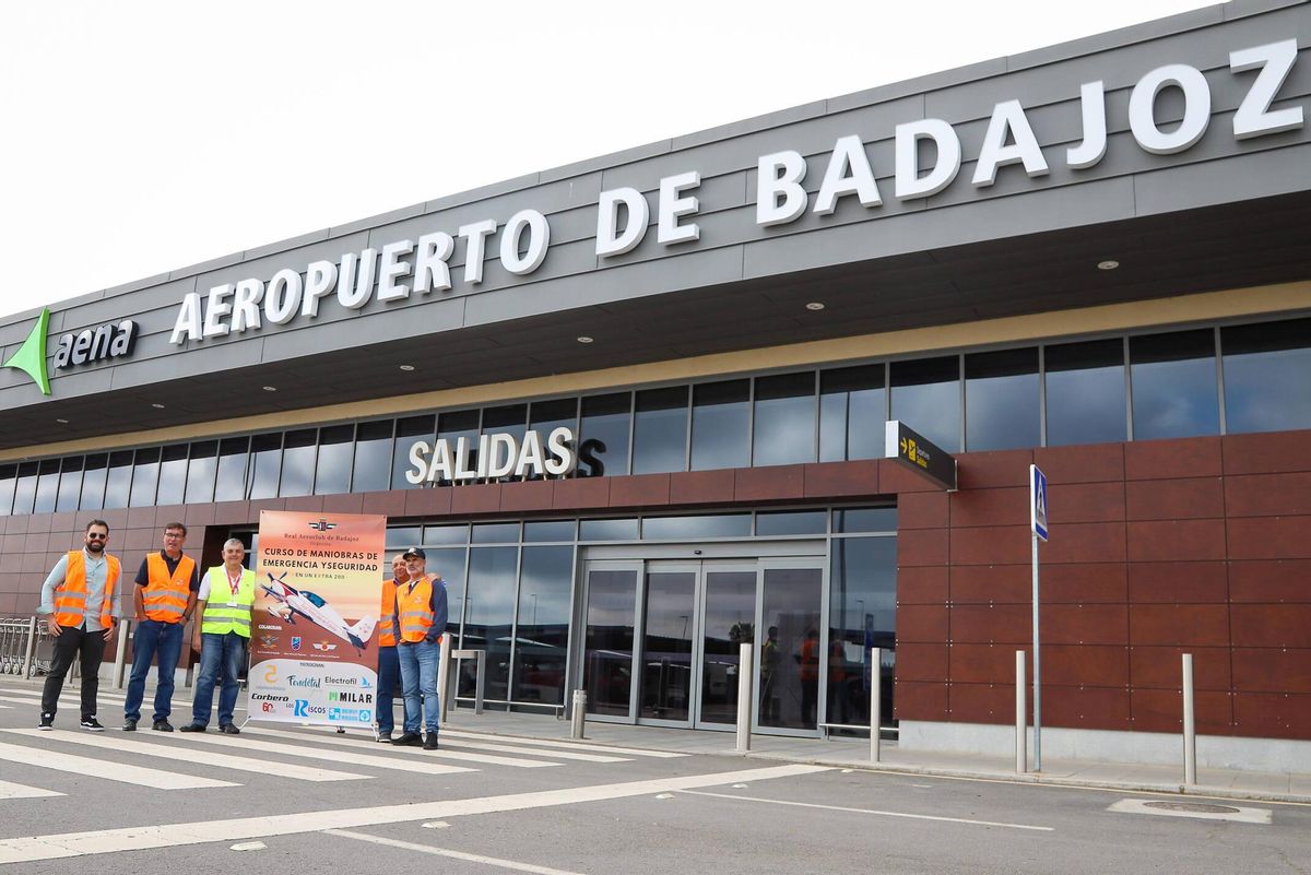 Con el cartel del curso.