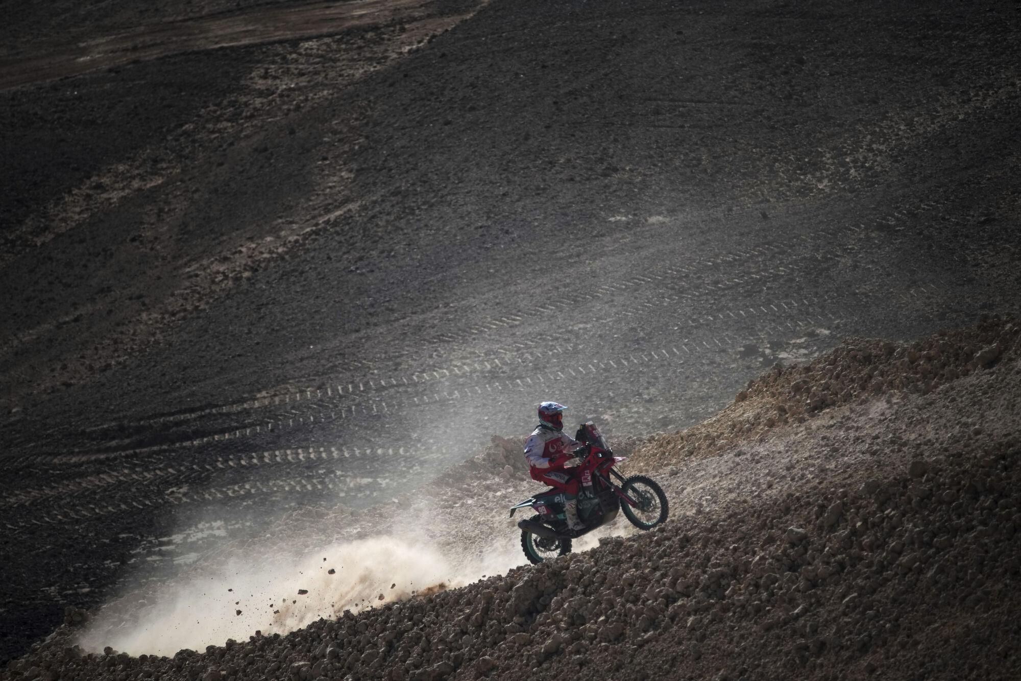 Rider Javi Vega competes during the ninth stage of the Dakar Rally between Riyadh and Haradh, Saudi Arabia, Tuesday, Jan. 14, 2025. (AP Photo/Christophe Ena)