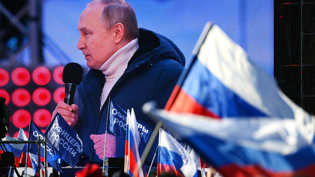 Russian President Vladimir Putin attends a concert marking the eighth anniversary of Russia's annexation of Crimea in Moscow