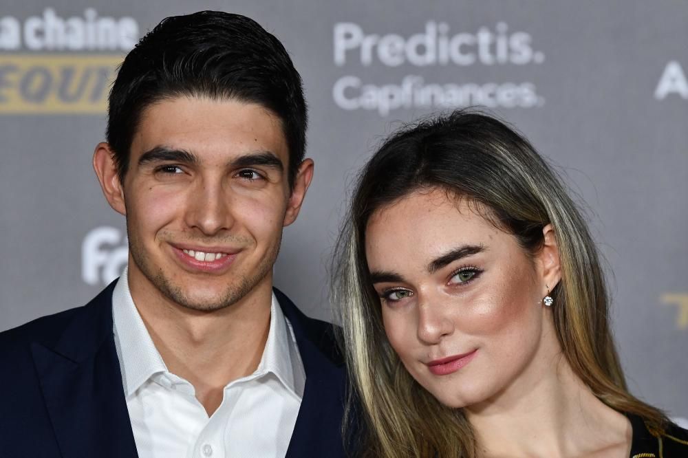 Formula 1's French driver Esteban Ocon (L) and guest pose upon arrival at the 2018 FIFA Ballon d'Or award ceremony at the Grand Palais in Paris on December 3, 2018. - The winner of the 2018 Ballon d'Or will be revealed at a glittering ceremony in Paris on December 3 evening, with Croatia's Luka Modric and a host of French World Cup winners all hoping to finally end the 10-year duopoly of Cristiano Ronaldo and Lionel Messi. (Photo by Anne-Christine POUJOULAT / AFP)