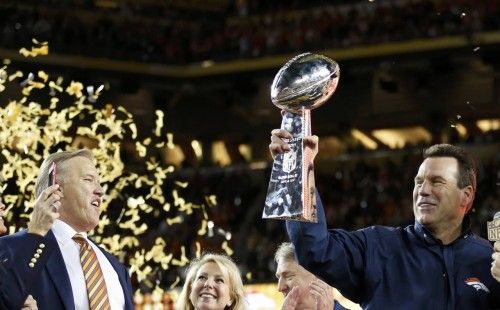 Denver Broncos' head coach Kubiak holds the Vince Lombardy Trophy as Broncos President and General Manager Elway looks on after the Broncos defeated the Carolina Panthers in the NFL's Super Bowl 50 football game in Santa Clara