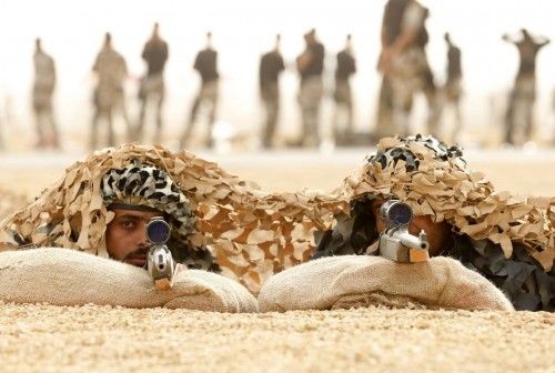 Members of Saudi special forces aim their guns during a training session in Darma, west of Riyadh