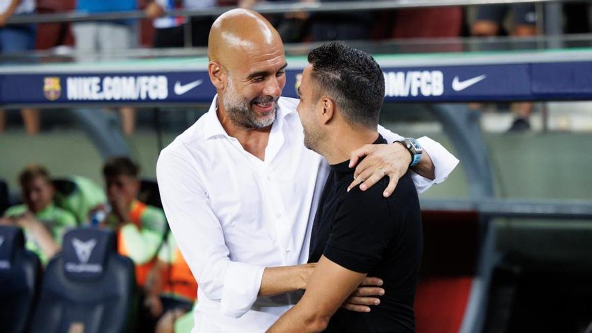 Guardiola y Xavi.