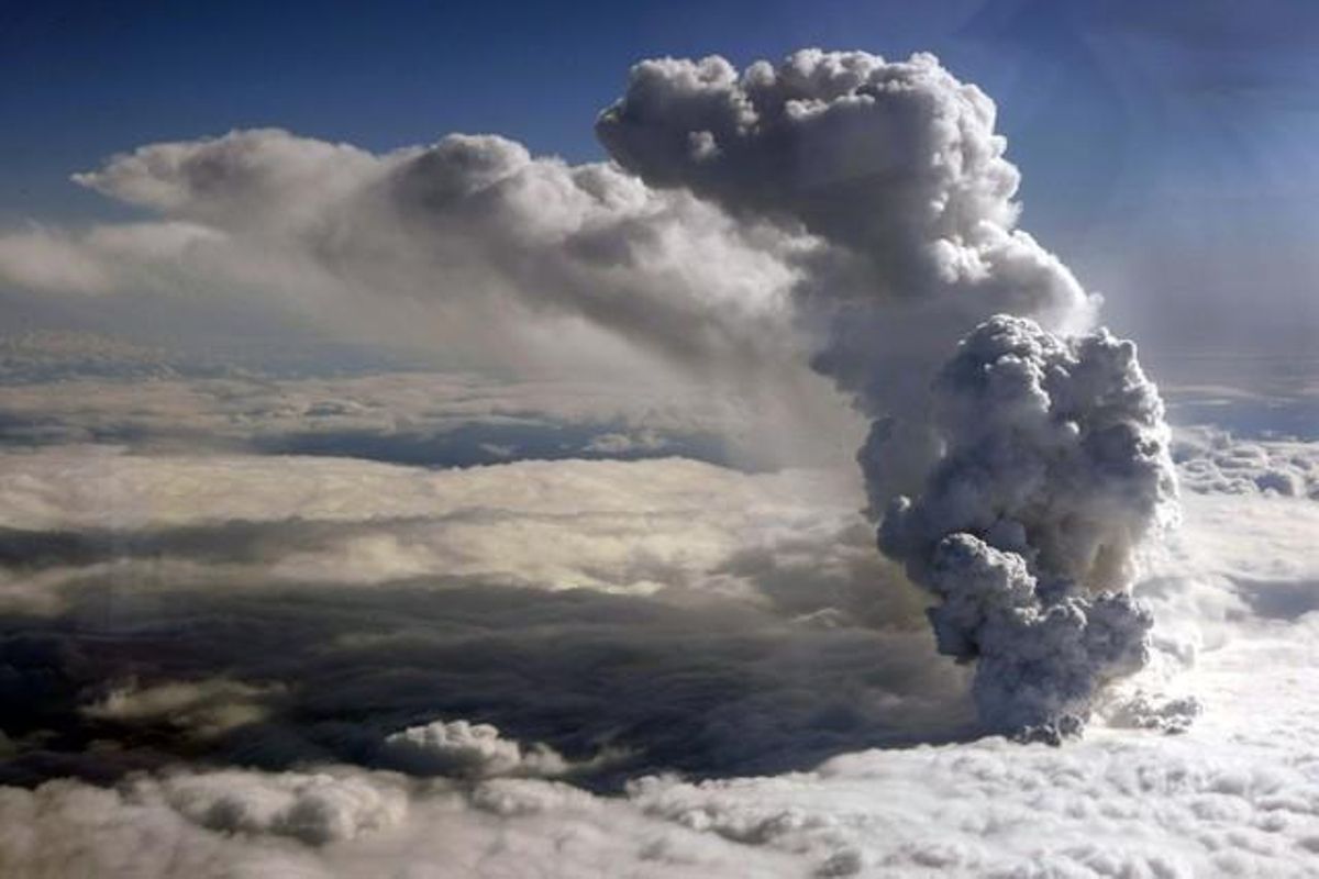 An aerial handout photo from the Icelandic Coast Guard xous a plume of steam rising 22,000 feet (6700 meters) from a crater under about 656 feet (200 metres) of ice at the Eyjafjallajokull glacier in southern