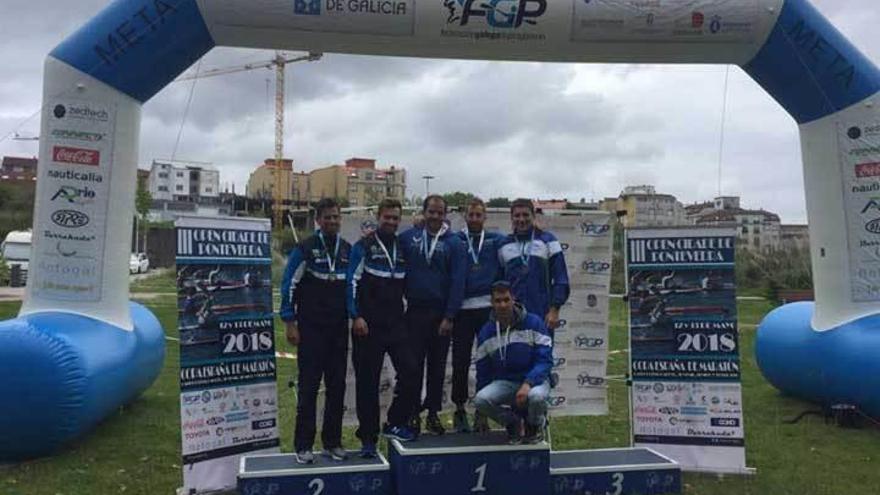 Luis Amado Pérez y Miguel Llorens, en el centro del podio.