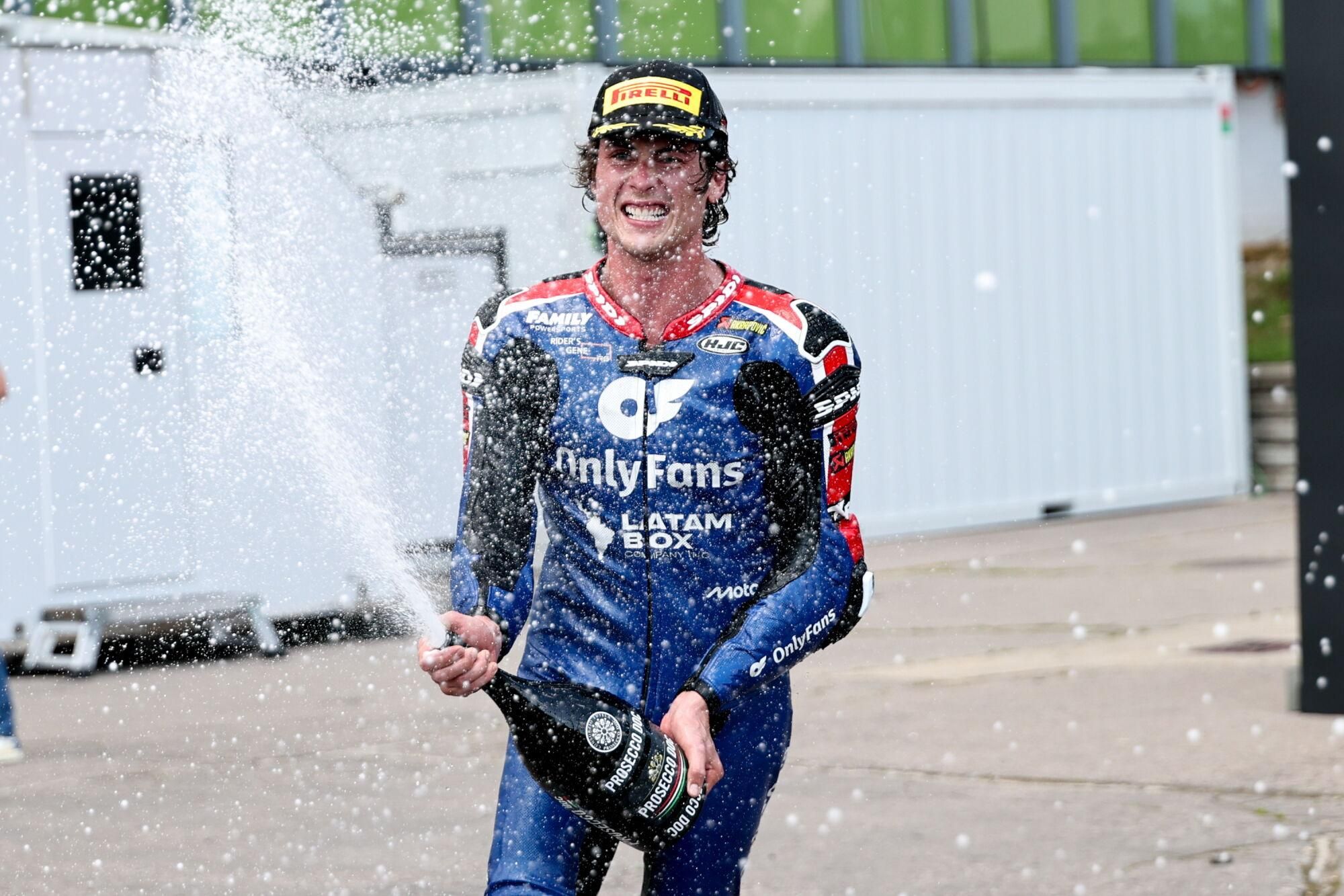 BRNO (Czech Republic), 20/07/2025.- OnlyFans American Racing Team's rider Joe Roberts, celebrates on the podium winning the Moto 2 race of the Motorcycling Grand Prix of Czechia at the Automotodrom Brno racetrack in Brno, Czechia, 20 July 2025. (Motociclismo) EFE/EPA/FILIP SINGER