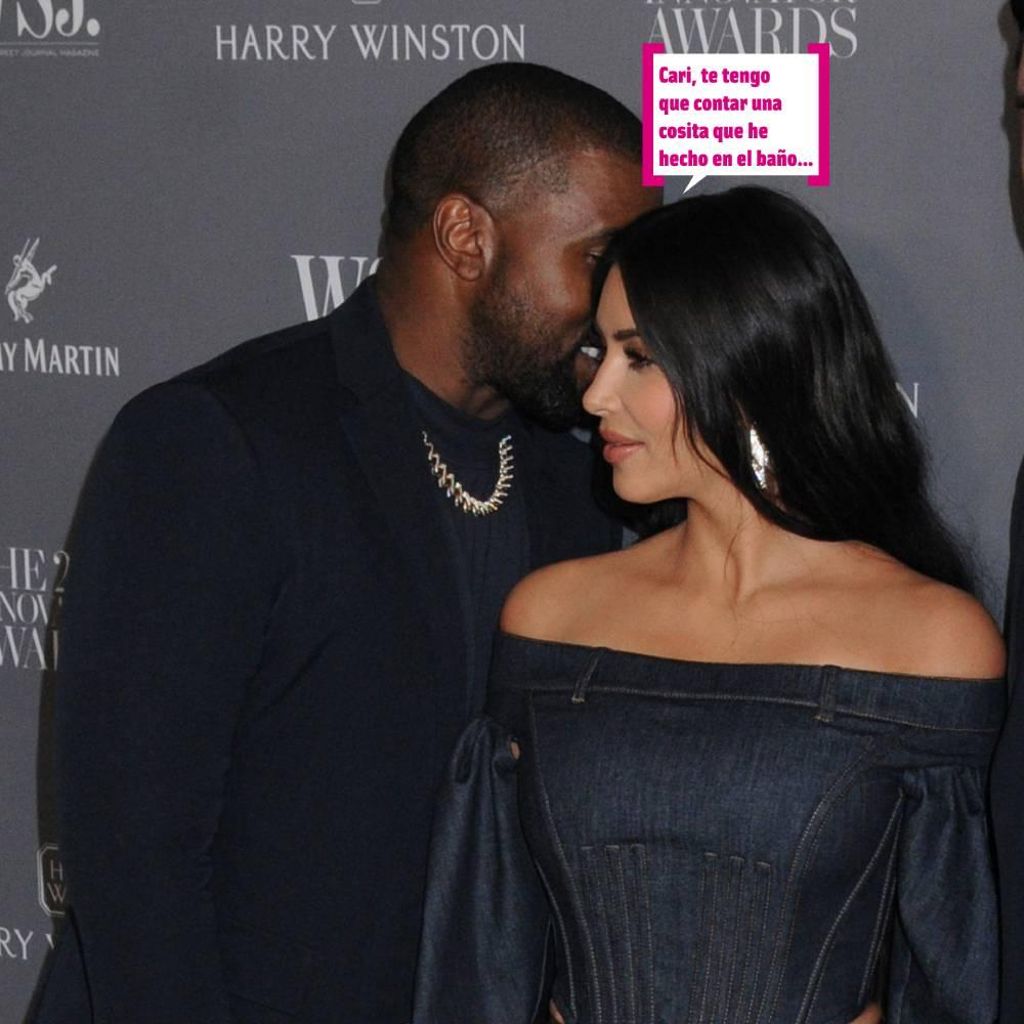 Kanye West diciéndole una cosa al oído a Kim Kardashian