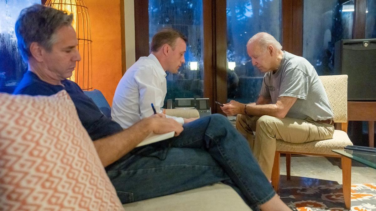 U.S. President Biden speaks with Poland's President Duda behind the scenes at the G20 summit