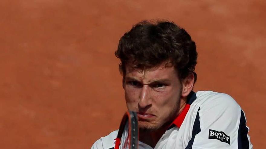 Pablo Carreño golpea de revés en su partido ante Dimitrov.