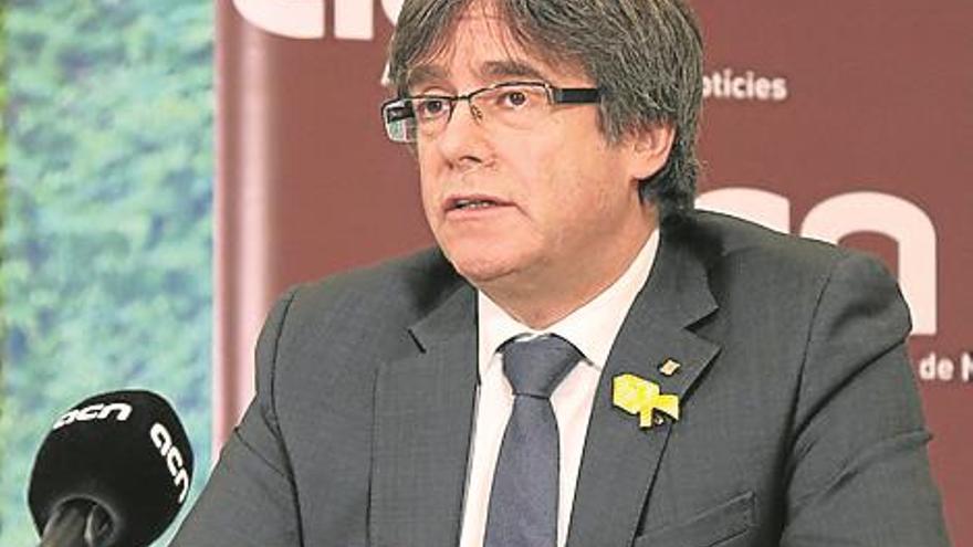 Puigdemont dice que volverá a Cataluña si gana