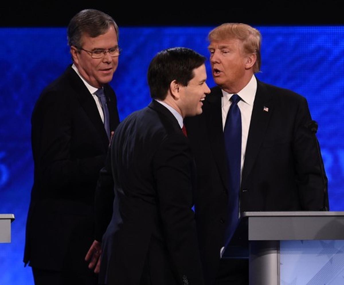 Republican presidential candidates Jeb Bush (L), Marco Rubio (C) and Donald Trump (R) greet one another following the Republican Presidential Candidates Debate on February 6, 2016 at St. Anselm’s College Institute of Politics in Manchester, New Hampshire.