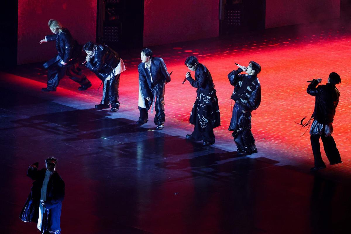 TOPSHOT - K-pop boy group BTS perform during their concert at Gwanghwamun Square in Seoul on March 21, 2026. South Korean megastars BTS reunite on March 21, for their first show in nearly four years, with an expected 260,000 fans taking over central Seoul for a K-pop extravaganza livestreamed to millions more worldwide. (Photo by Kim Hong-Ji / POOL / AFP)
