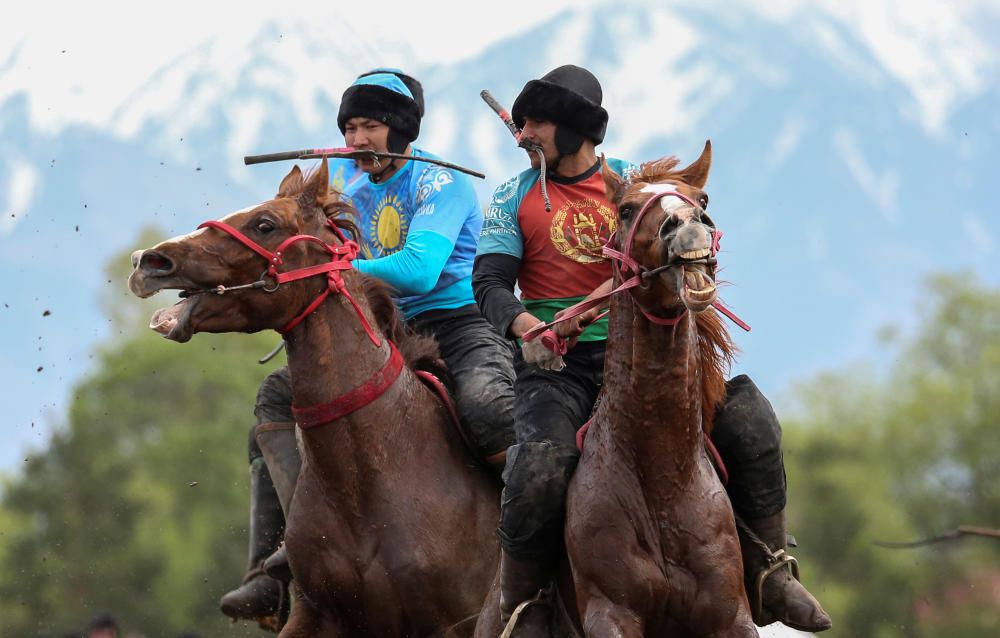 Horsemen play Kokpar during a regional ...