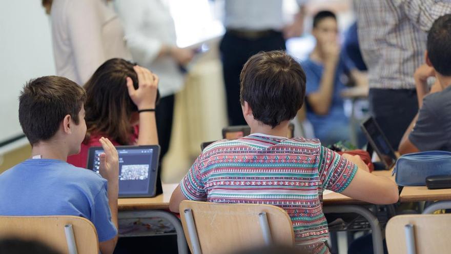 Estudiantes en clase, en una imagen de archivo