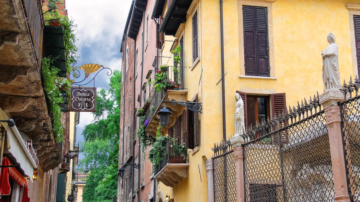 Houses on the street Via Arche Scaligere in Verona, Italy