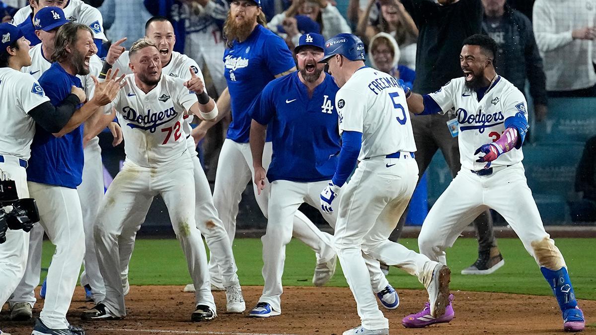 Los Angeles Dodgers' Freddie Freeman (5) crosses home plate after hitting a walk off home run during the 18th inning in Game 3 of baseball's World Series against the Toronto Blue Jays, Monday, Oct. 27, 2025, in Los Angeles. (AP Photo/David J. Phillip)