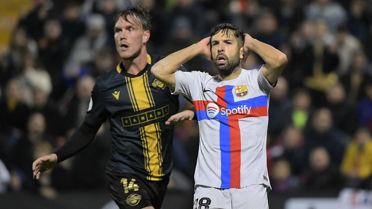 Barcelona's Spanish defender Jordi Alba (R) reacts next to Intercity's Spanish defender Vadik Murria during the Spain's Copa del Rey (King's Cup) round of 32, first leg, footbal match between Intercity CF and FC Barcelona at the Jose Rico Perez stadium in Alicante, on January 4, 2023. (Photo by Jose Jordan / AFP)