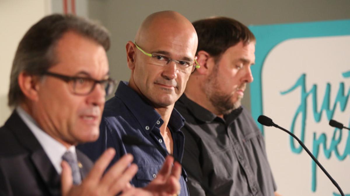 Artur Mas, Raül Romeva y Oriol Junqueras, este lunes, 21 de septiembre, en un acto de Junts pel Sí.