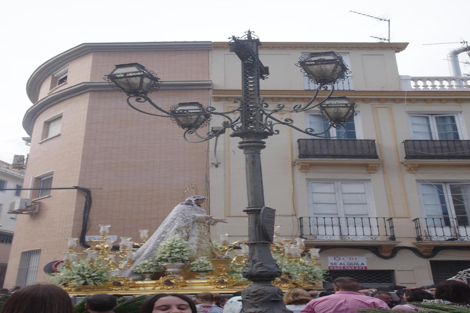 La procesión de la Virgen del Rocío por la Victoria y Lagunillas, en imágenes