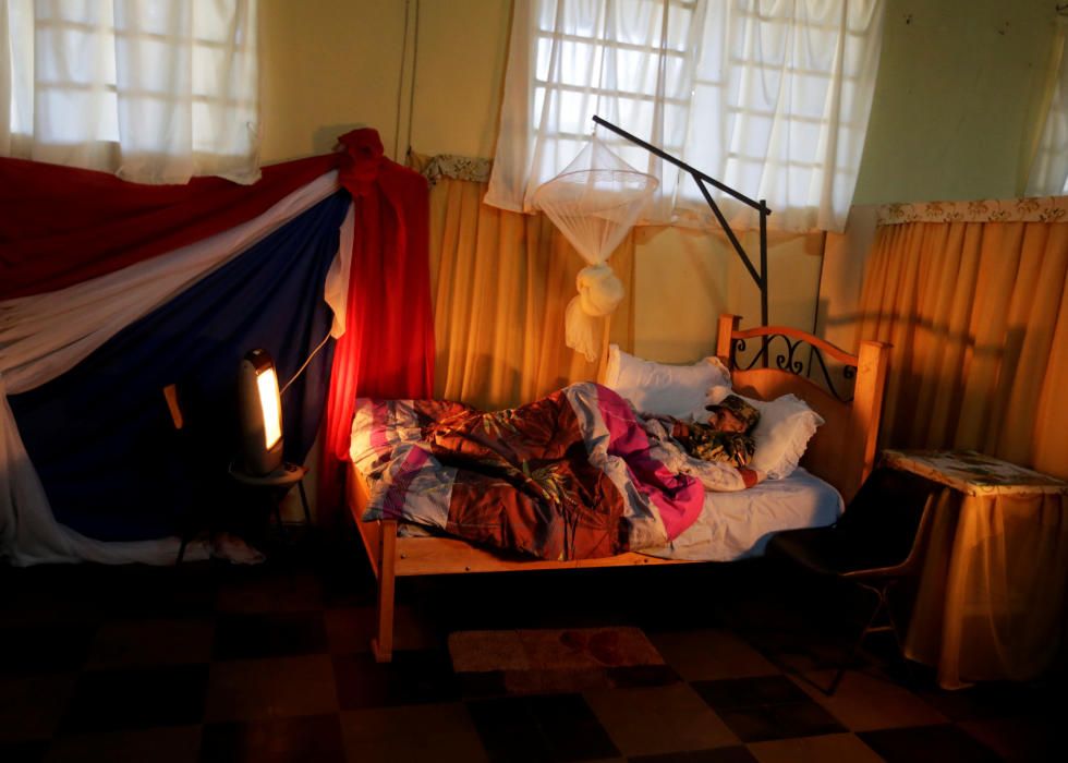 Veteran Andres Benitez, 104, lies in bed dressed ...