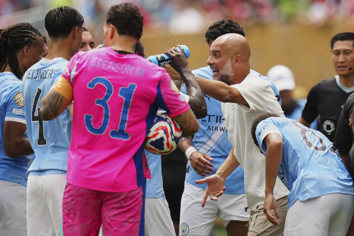 Manchester City manager Pep Guardiola talks to his players during the Club World Cup group G soccer match between Manchester City and Wydad AC in Philadelphia, Wednesday, June 18, 2025. (AP Photo/Derik Hamilton)