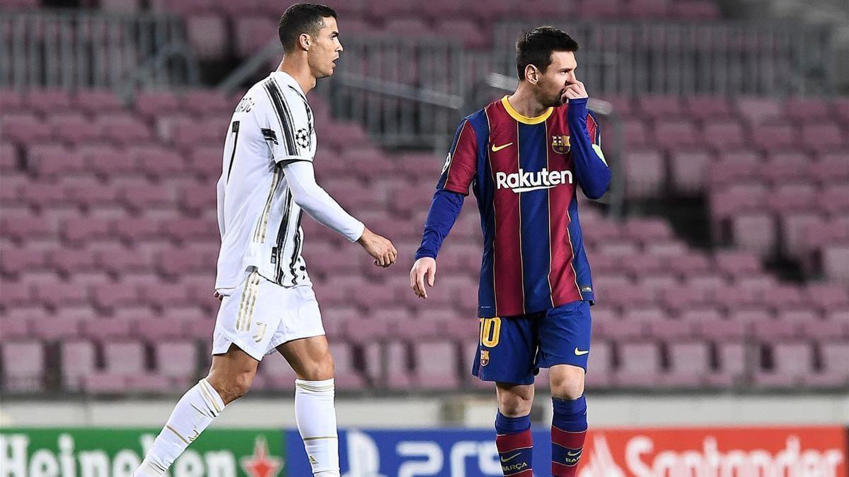 Juventus  Portuguese forward Cristiano Ronaldo (L) walks past Barcelona s Argentinian forward Lionel Messi during the UEFA Champions League group G football match between Barcelona and Juventus at the Camp Nou stadium in Barcelona on December 8  2020  (Photo by Josep LAGO   AFP)