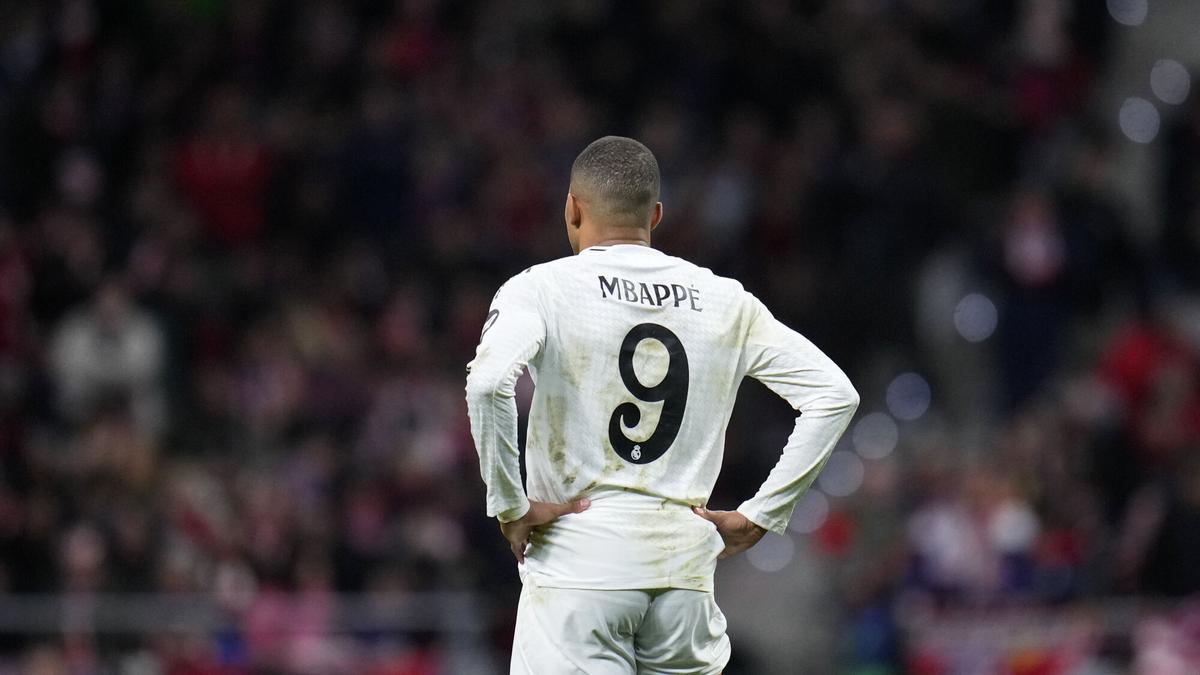 Real Madrid's Kylian Mbappe reacts during the Champions League round of 16, second leg, soccer match between Atletico Madrid and Real Madrid at the Metropolitano stadium in Madrid, Spain, Wednesday, March 12, 2025. (AP Photo/Manu Fernandez)