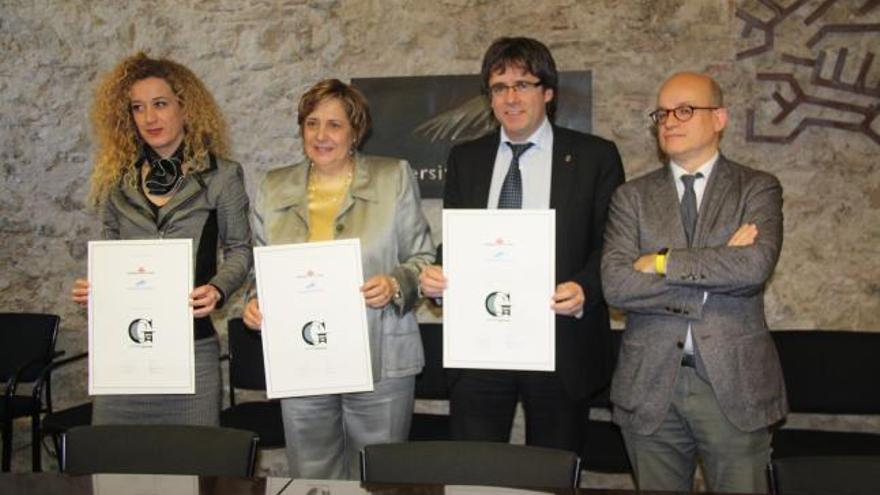 La directora de la Càtedra &#039;Girona Smart City&#039;, Lluïsa Marsal, Anna Maria Geli, Carles Puigdemont i Joaquim Matria Puigvert, a la UdG.