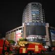 ZIGONG, July 18, 2024  -- This photo taken on July 18, 2024 shows firefighting vehicles at the site of a department store fire in Zigong City, southwest Chinas Sichuan Province. The rescue operation at the site of the department store fire in Zigong City