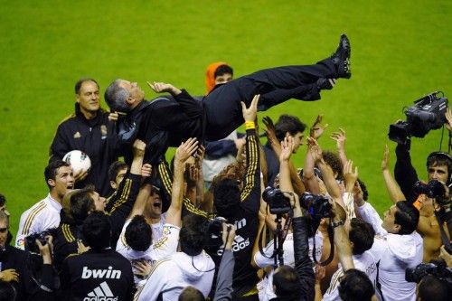 Real Madrid's coach Jose Mourinho is thrown in the air by his players after their win over Athletic Bilbao to win the Spanish first division league title in Bilbao