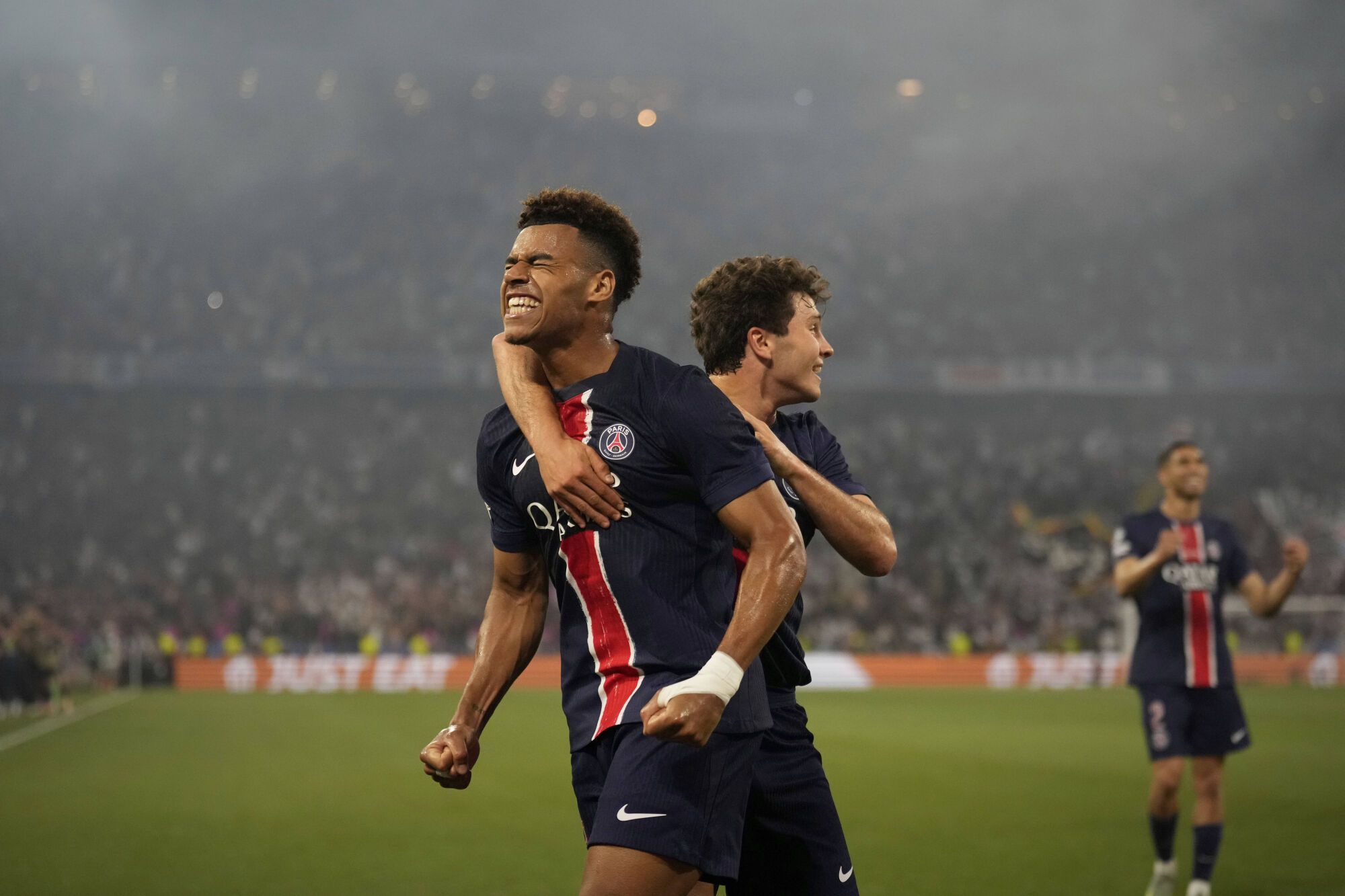 PSG's Desire Doue celebrates after scoring his side's second goal during the Champions League final soccer match between Paris Saint-Germain and Inter Milan at the Allianz Arena in Munich, Germany, Saturday, May 31, 2025. (AP Photo/Matthias Schrader)