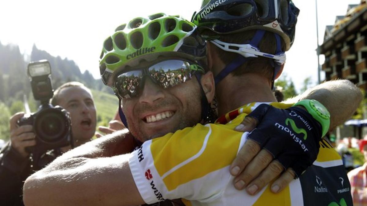 Movistar rider Valverde of Spain congratulates his team mate Costa of Portugal for winning the Tour de Suisse cycling race after the ninth and final stage of the race in Soerenberg