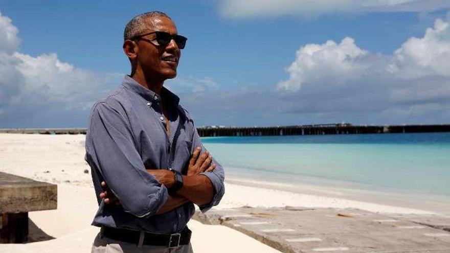 Barack Obama, sonriente en la reserva. // Reuters