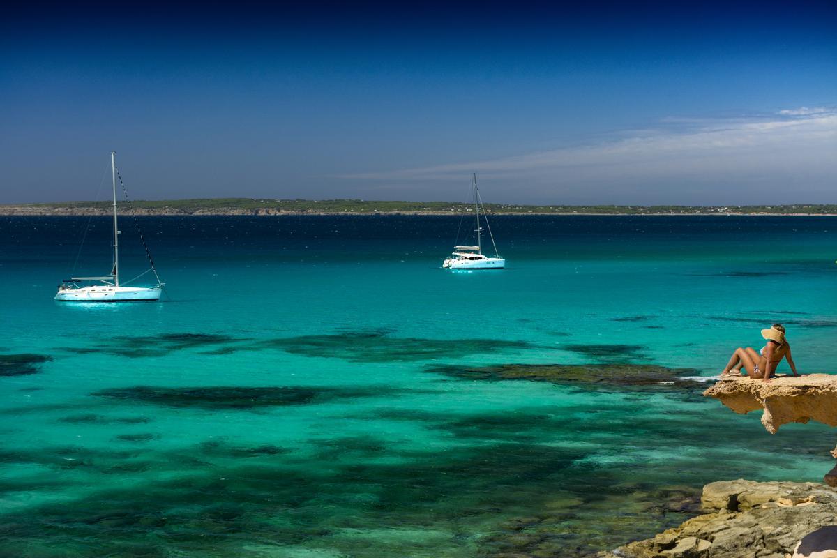 Woman looking at the sea in Formentera.