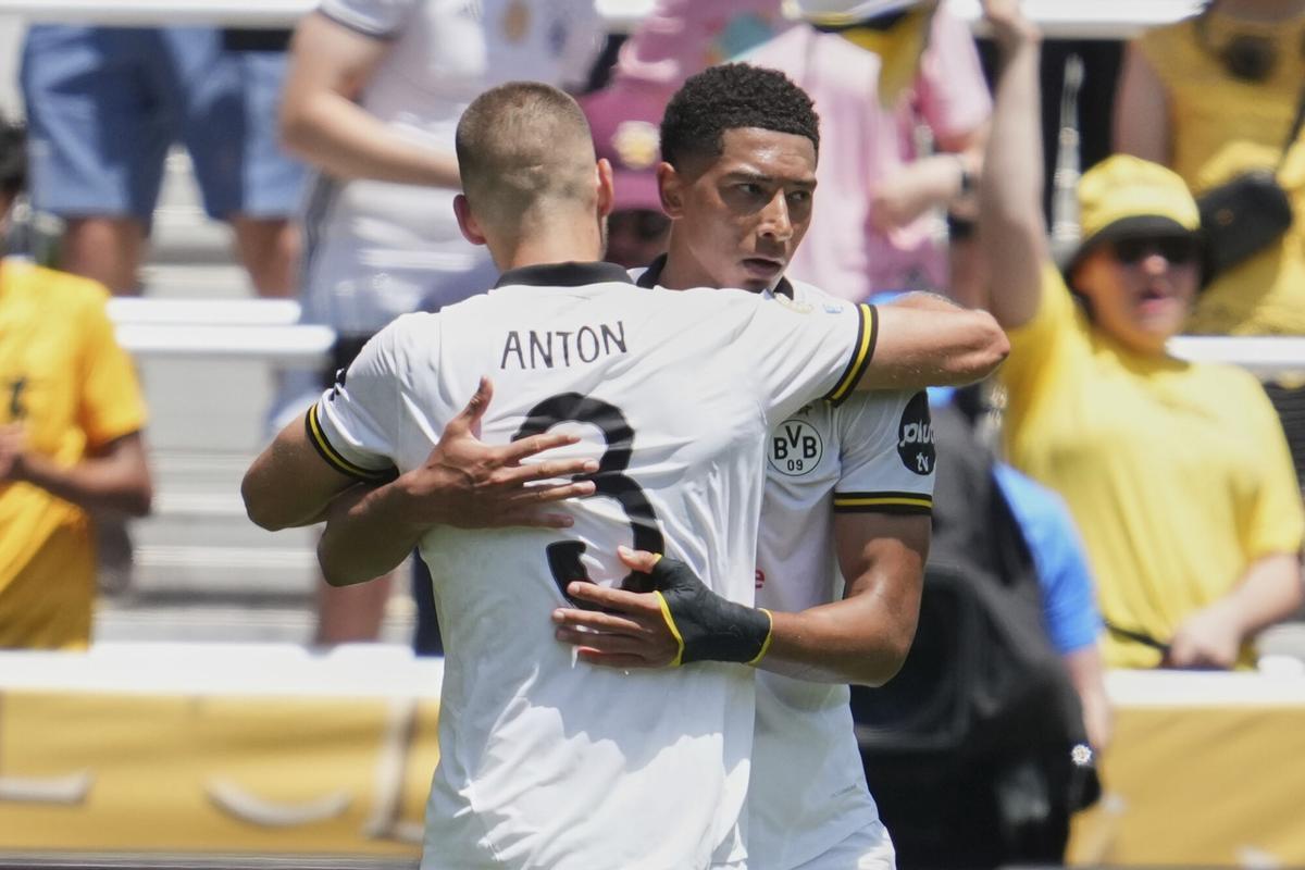 Borussia Dortmund's Waldemar Anton, and Jobe Bellingham celebrate after a goal during the Club World Cup Group F soccer match between Mamelodi Sundowns and Borussia Dortmund in Cincinnati, Saturday, June 21, 2025. (AP Photo/Jeff Dean)