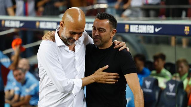 Xavi y Pep, en el Camp Nou