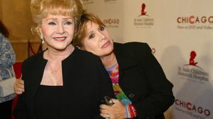 FILE - In this Tuesday, Aug. 19, 2003 file photo, Debbie Reynolds and Carrie Fisher arrive at the Runway for Life Celebrity Fashion Show Benefitting St. Jude’s Children’s Research Hospital and celebrating the DVD relese of Chicago in Beverly Hills, Calif. On Tuesday, Dec. 27, 2016, a publicist said Fisher has died at the age of 60. (AP Photo/Jill Connelly, File)