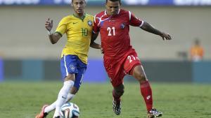 FILE - In this Tuesday, June 3, 2014, file photo, Brazil’s Neymar, left, fights for the ball with Panama’s Amilcar Henriquez during a friendly soccer match at the Serra Dourada stadium in Goiania, Brazil. Police in Panama said Henriquez was shot dead while leaving his home on Saturday, April 15, 2017. (AP Photo/Andre Penner, File)