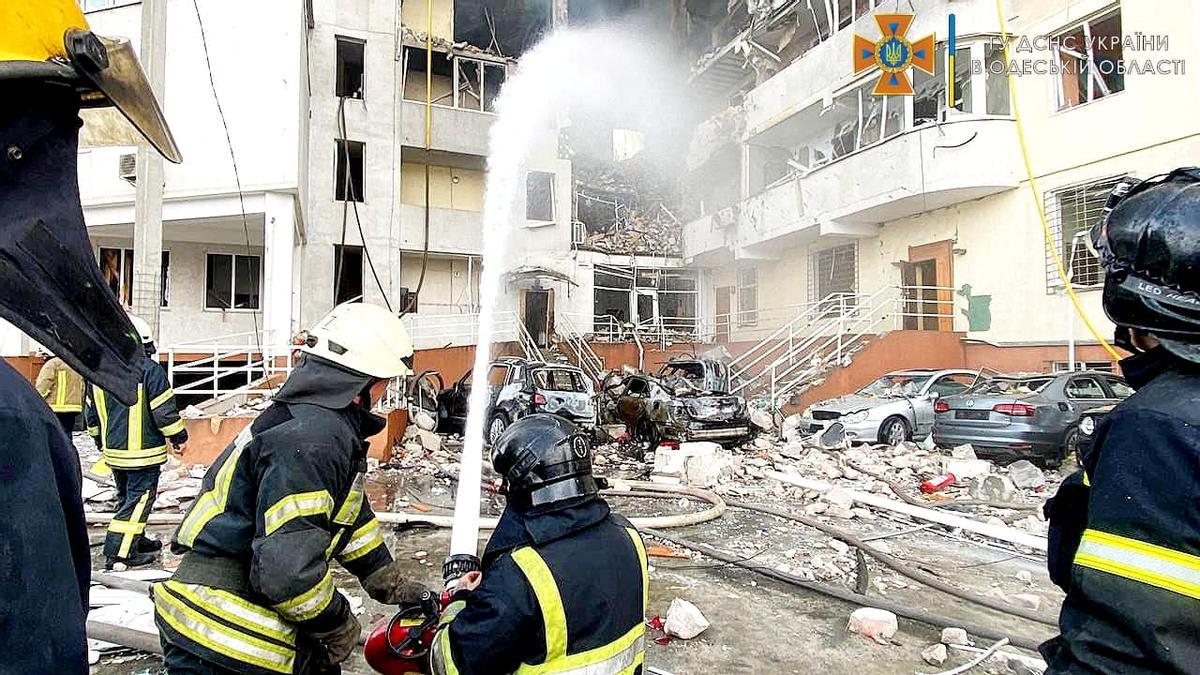 Emergency service workers rescue people after a missile strike, as Russia's invasion of Ukraine continues, in Odesa Oblast