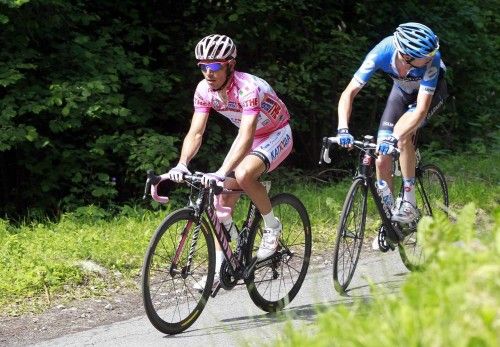 Katusha Team's Joaquim Rodriguez Oliver of Spain, wearing the leader's pink jersey, climbs Mortirolo ahead of Garmin-Barracuda's Ryder Hesjedal of Canada during the 219km (136 miles) 20th stage of the Giro d'Italia