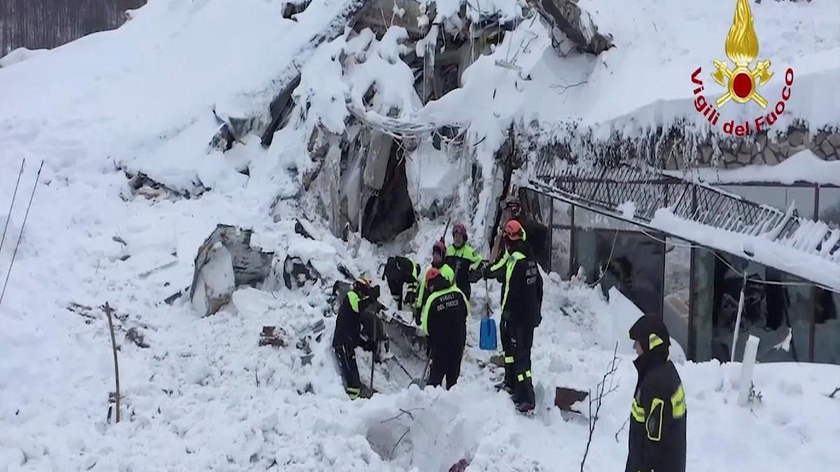 A photo taken from a video shows firefighters work at Hotel Rigopiano in Farindola