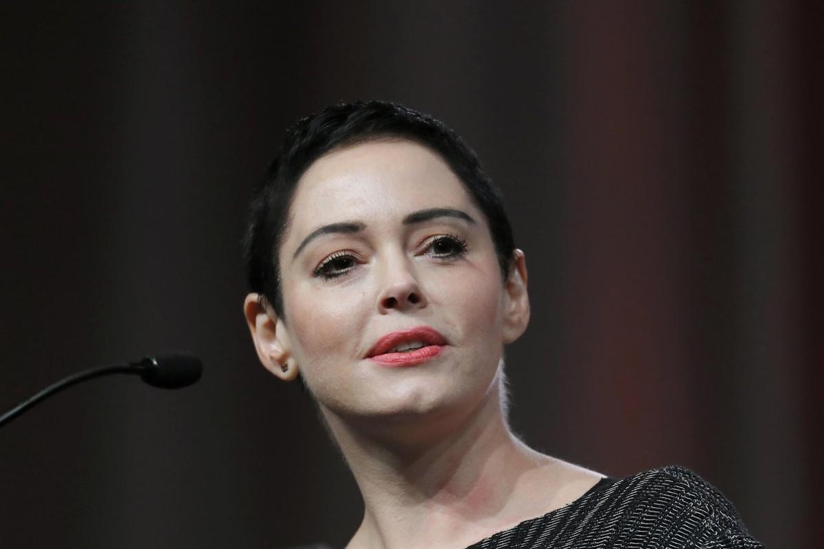 FILE- In this Oct. 27, 2017, file photo, actress Rose McGowan speaks at the inaugural Women’s Convention in Detroit. McGowan has filed a federal lawsuit alleging that Harvey Weinstein and two of his former attorneys engaged in racketeering to silence her and shut down her career before she accused Weinstein of rape. (AP Photo/Paul Sancya, File)