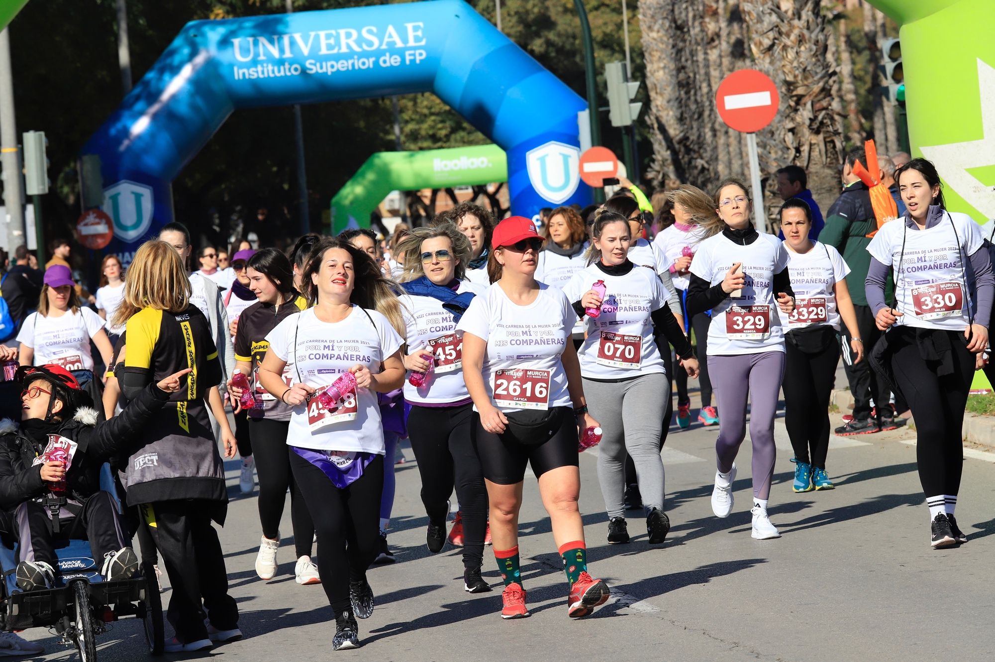 La salida y el recorrido de la Carrera de la Mujer 'inmortalizados' en imágenes