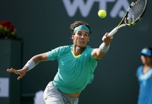 Nadal returns a serve against Del Potro during men's singles final match at the BNP Paribas Open ATP  tennis tournament in Indian Wells
