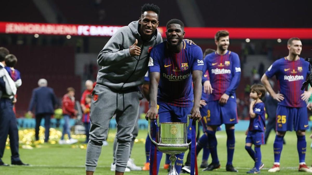 Yerry Mina y Umtiti durante la celebración del título